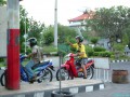 My brother proudly fueling up his rented 100cc which he was driving w/o license, hehe